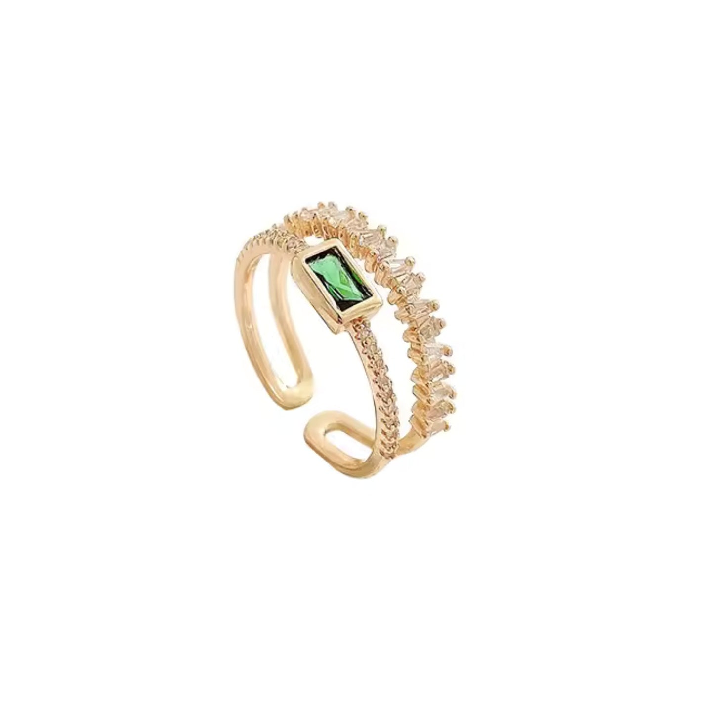 Close-up of the Emerald Radiance Adjustable Ring featuring a green zircon centerpiece and baguette-cut crystals on an 18K gold-plated band.