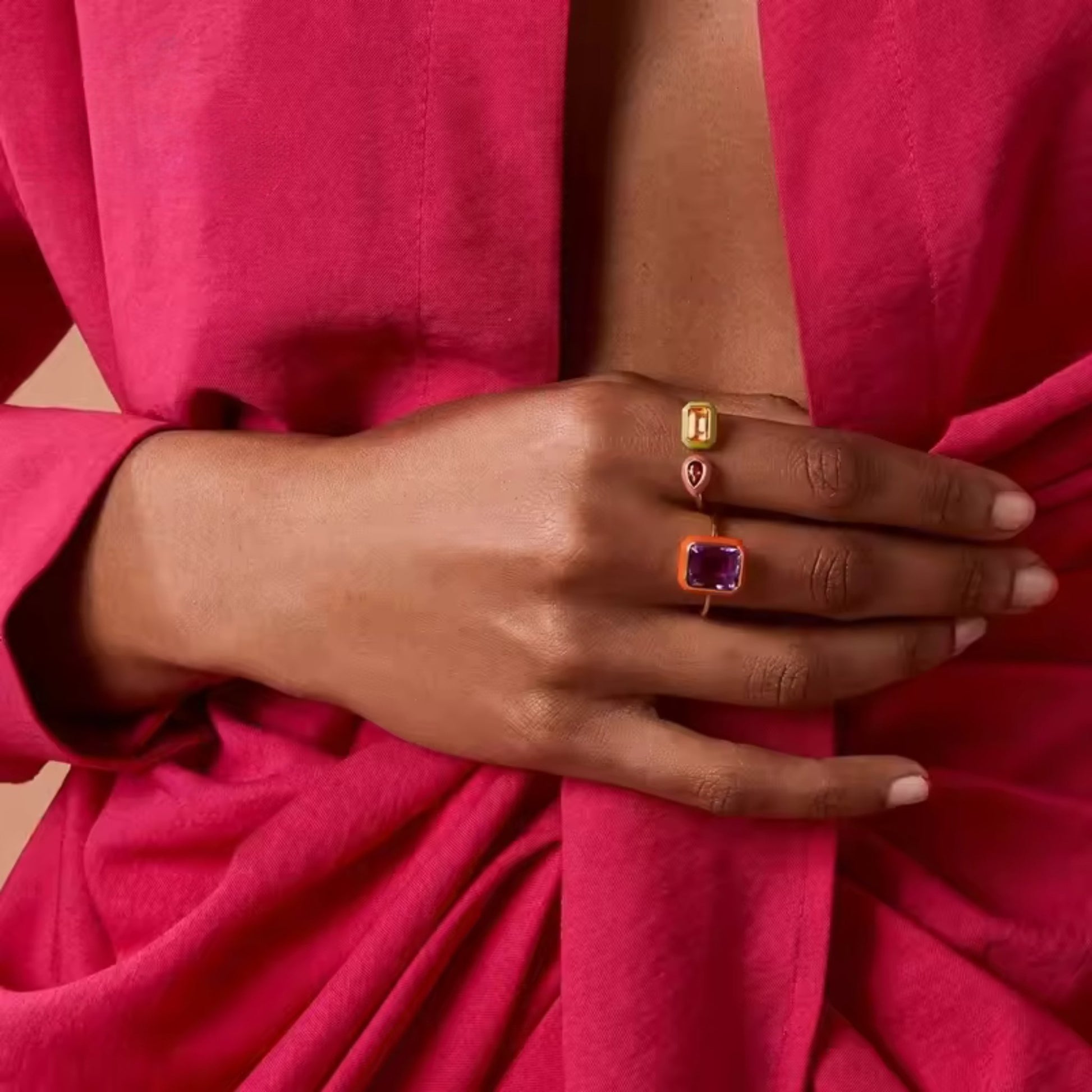 Enamel Duo Gemstone Ring stacked with other gold-plated rings for a chic and layered look.