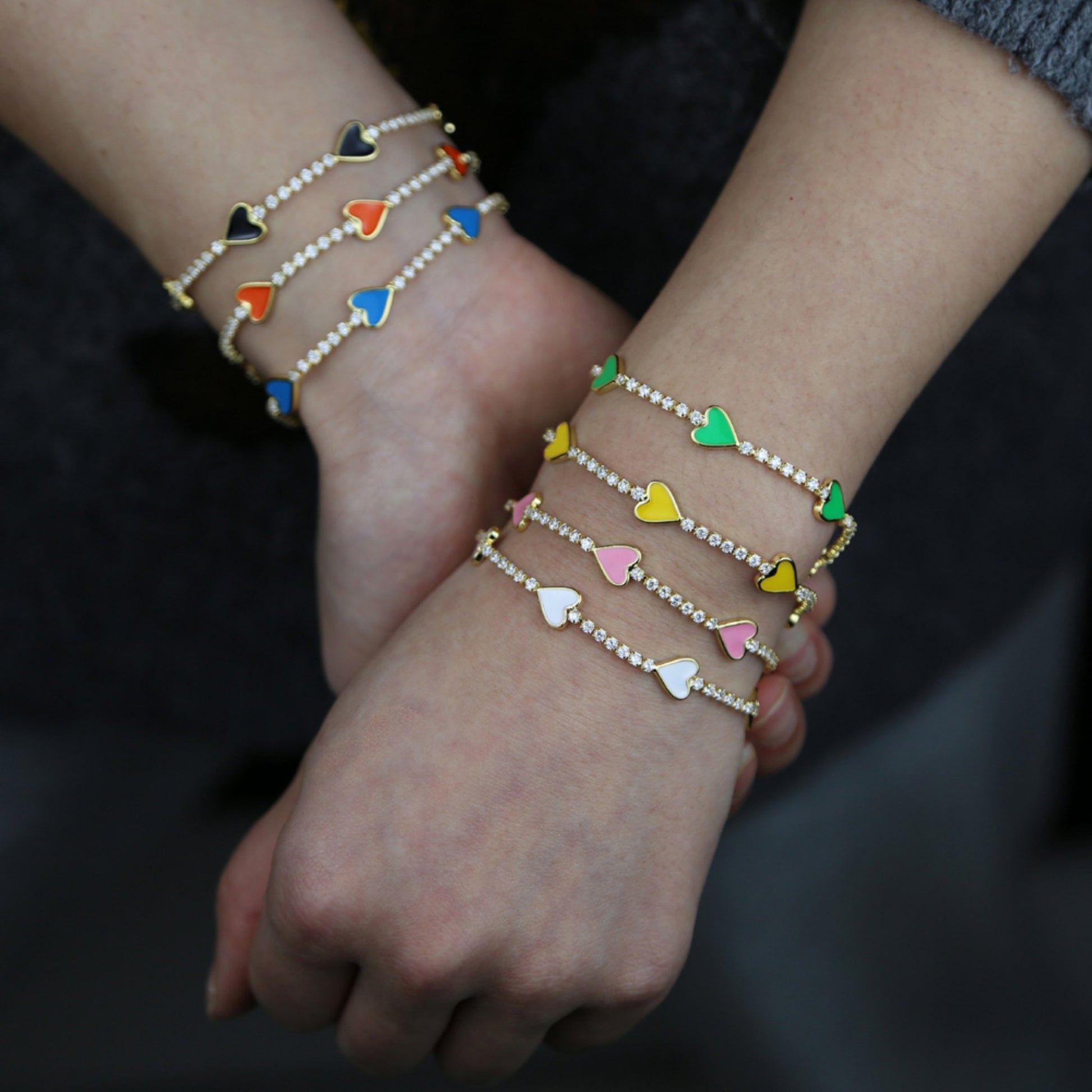 Enamel Heart Gold Plated Bracelet worn on a wrist, highlighting its playful yet elegant design.