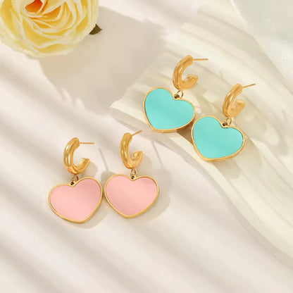 Enamel Heart Hoop Earrings styled alongside matching accessories, showcasing their vibrant enamel colors and minimalist hoop design.