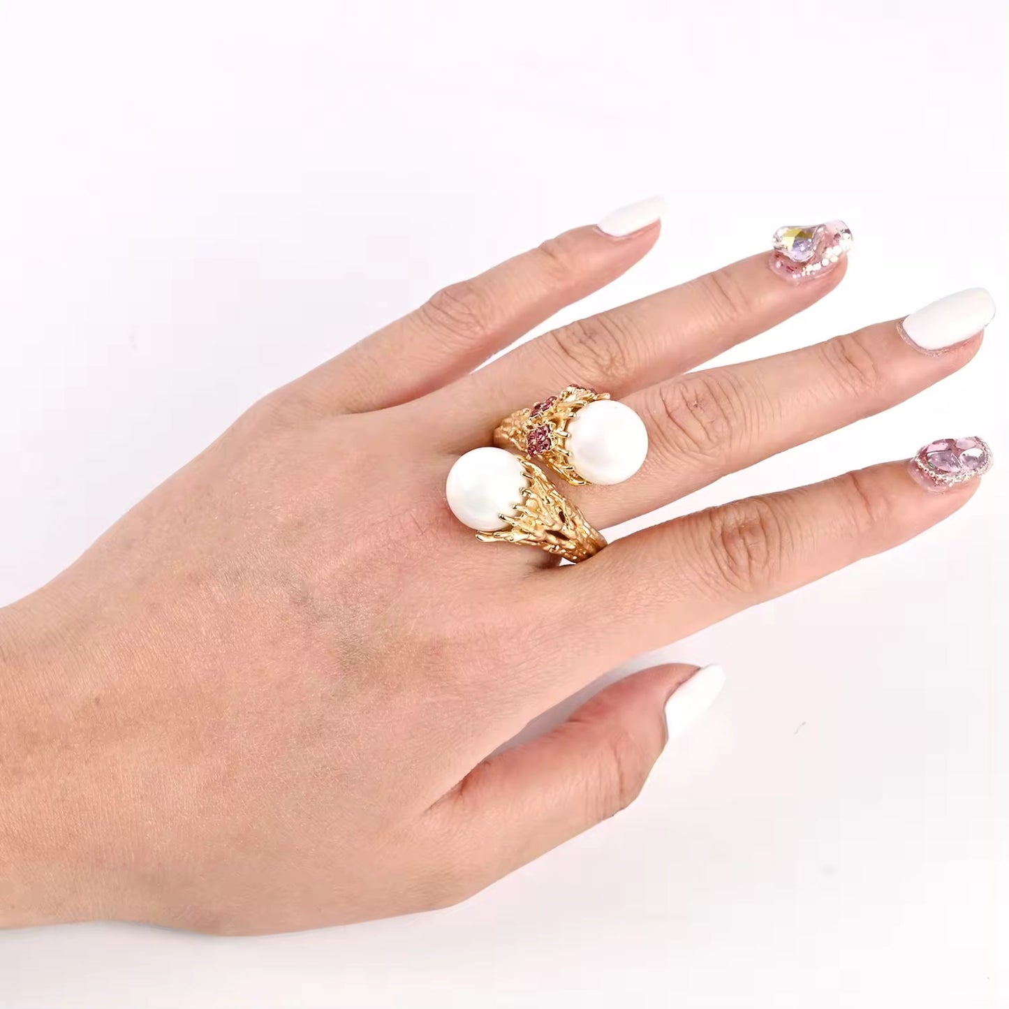 Model showcasing the Enchanted Pearl Branch Ring on her finger, highlighting its nature-inspired elegance and intricate branch details.
