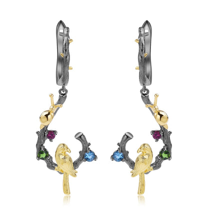 Swiss Blue Topaz Bird & Snail Earrings crafted from 925 Sterling Silver with gold plating, featuring topaz, amethyst, and peridot stones in a nature-inspired design.