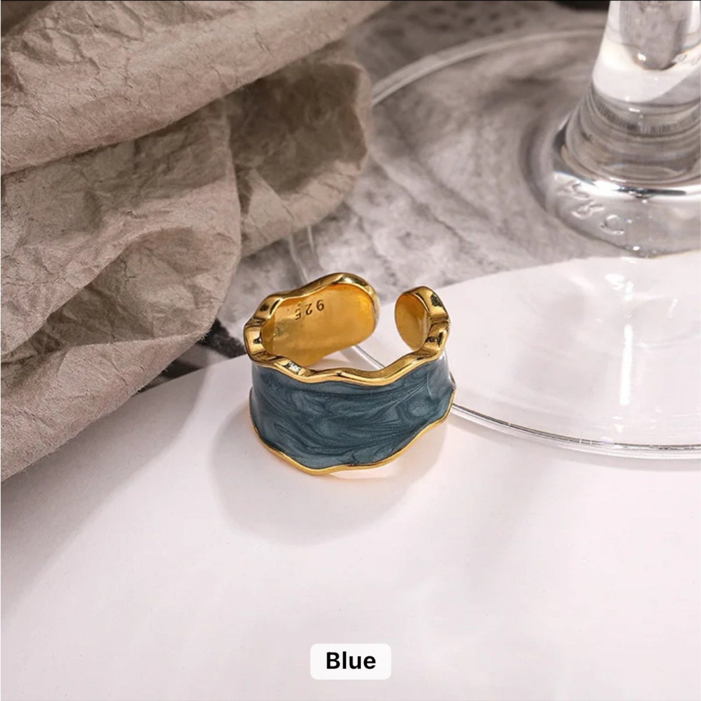 Enchanted Wave Adjustable Ring in 18K gold-plated 925 Sterling Silver with luxurious Dark Blue enamel paint and a wave-shaped design.
