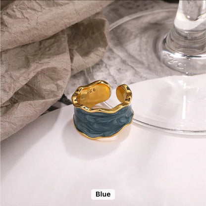 Enchanted Wave Adjustable Ring in 18K gold-plated 925 Sterling Silver with luxurious Dark Blue enamel paint and a wave-shaped design.
