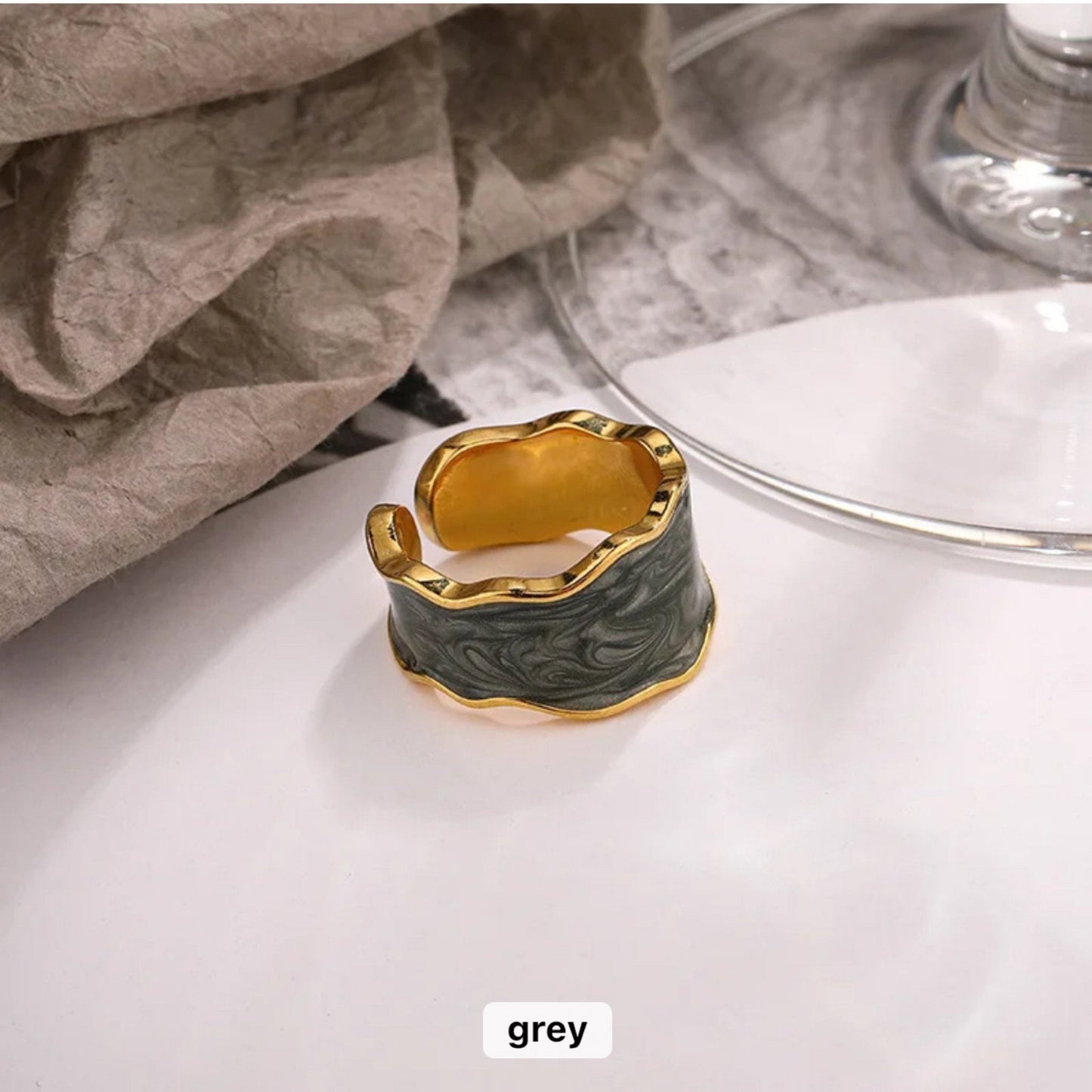 Enchanted Wave Adjustable Ring in 18K gold-plated 925 Sterling Silver with luxurious Grey enamel paint and a wave-shaped design.