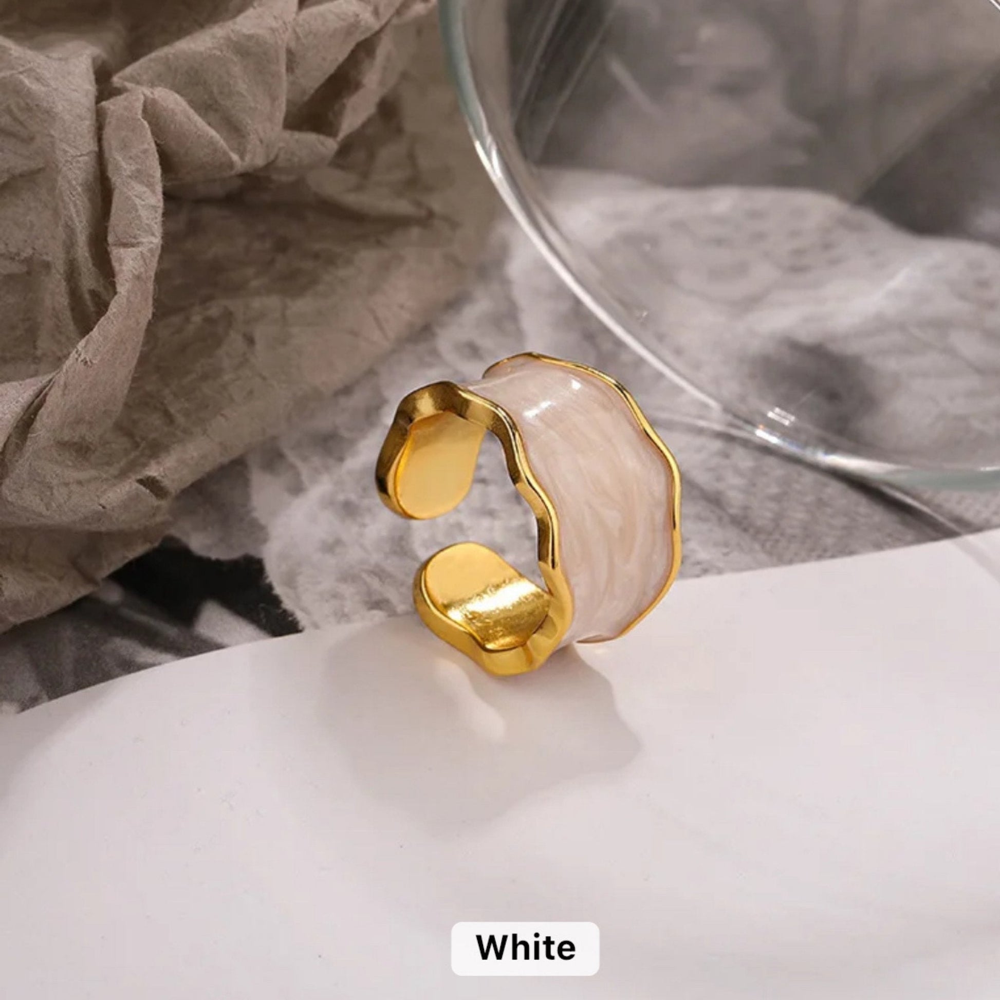 Enchanted Wave Adjustable Ring in 18K gold-plated 925 Sterling Silver with luxurious White enamel paint and a wave-shaped design.