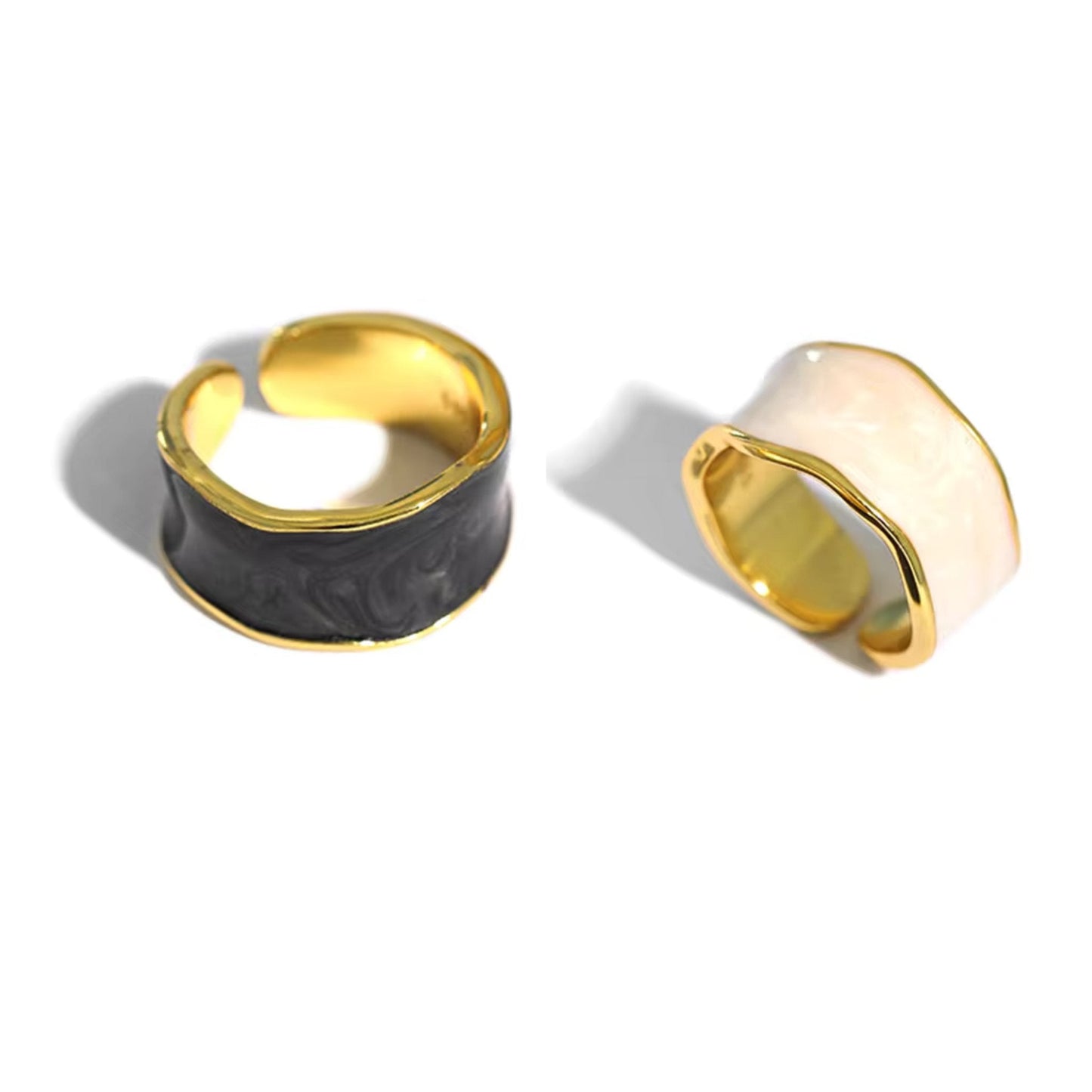 Set of Enchanted Wave Adjustable Rings in White, Purple, Dark Blue, and Dark Gray enamel, showcasing their elegant wave design and 18K gold-plated finish.