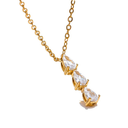 Close-up of the Exquisite Shimmer Cubic Zirconia Pendant Necklace, showcasing the trio of sparkling zirconia stones on a delicate gold-plated chain.