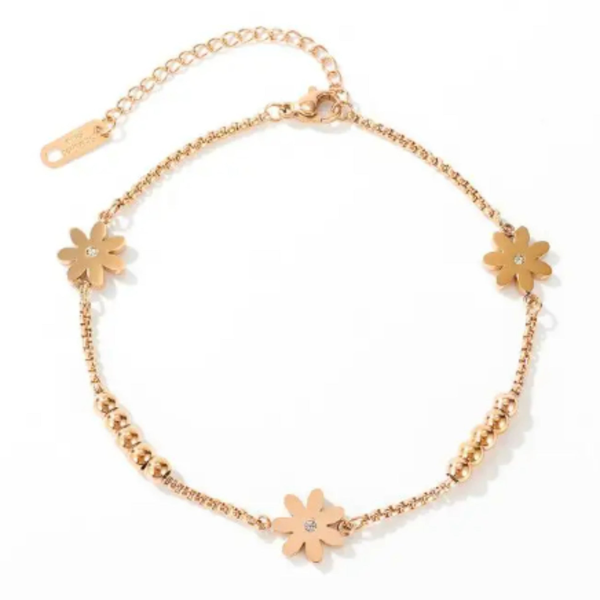 Floral Charm 18K Rose Gold Plated Anklet laid flat on a white background, highlighting its design and adjustable chain.