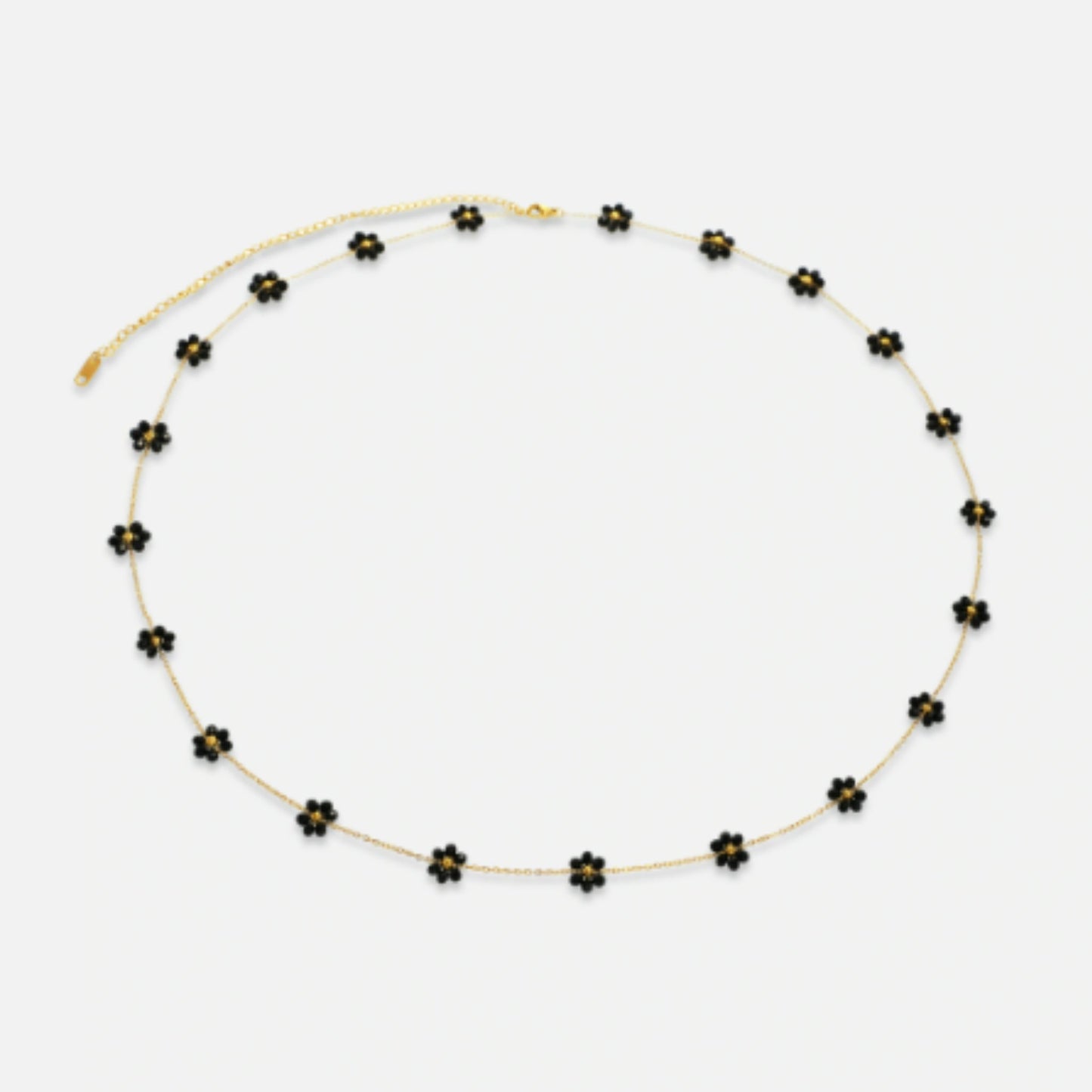 The Midnight Bloom Belly Chain with bold black floral charms, perfect for evening wear and special occasions.