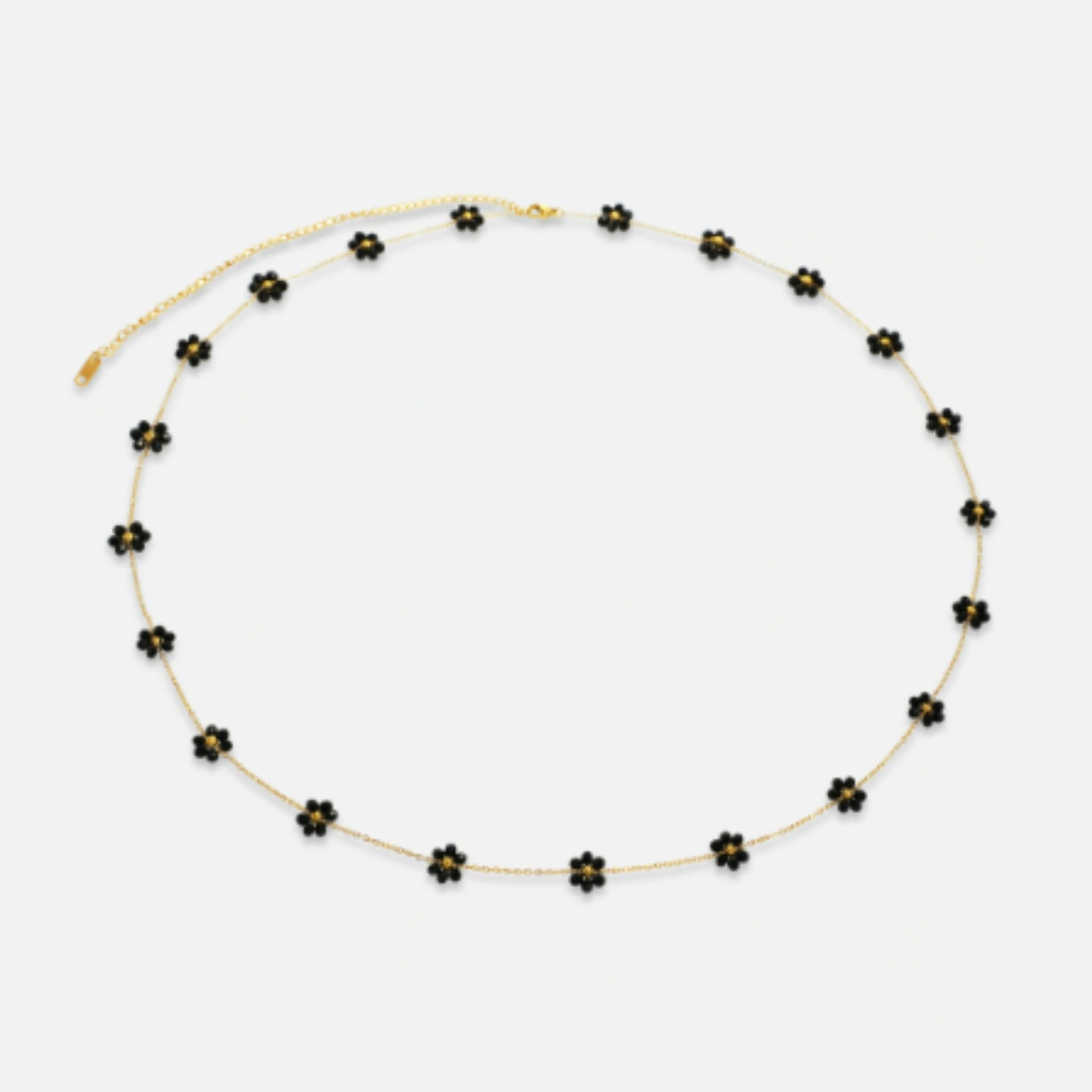 The Midnight Bloom Belly Chain with bold black floral charms, perfect for evening wear and special occasions.
