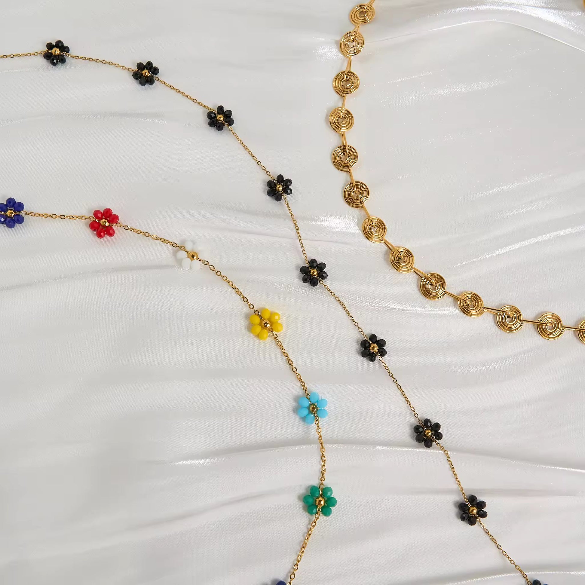 Close-up of the adjustable lobster clasp and extension chain, demonstrating the comfortable, customizable fit of the Floral Harmony Belly Chain Set.