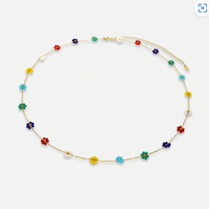 Playful Rainbow Blossom Belly Chain adorned with vibrant multicolored flowers, adding a joyful touch to summer outfits.