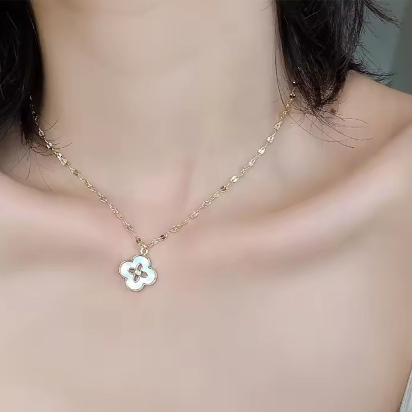 Model wearing the Floral Radiance Pendant Necklace, showcasing its elegant floral design and perfect fit on the neckline.