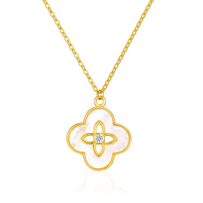Floral Radiance Pendant Necklace displayed on a white background, highlighting the intricate floral motif and gold-plated sterling silver chain.