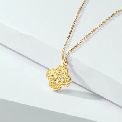 Close-up of the back Floral Radiance Pendant Necklace, showing the mother of pearl floral design and sparkling center crystal on an 18K gold-plated chain.