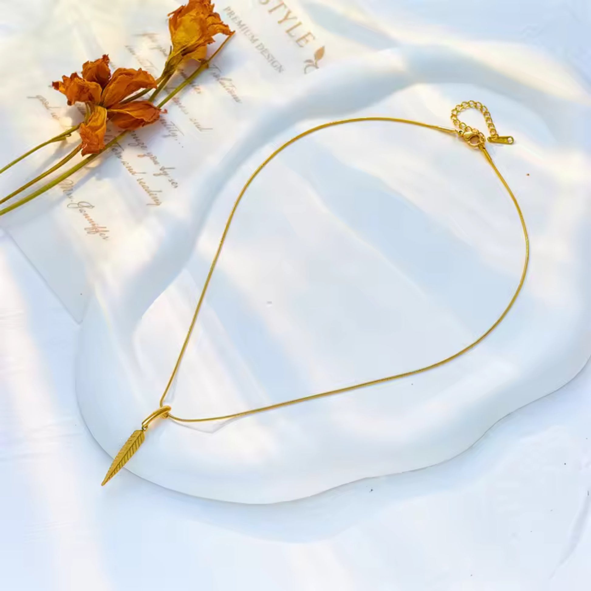 Golden Feather Pendant Necklace