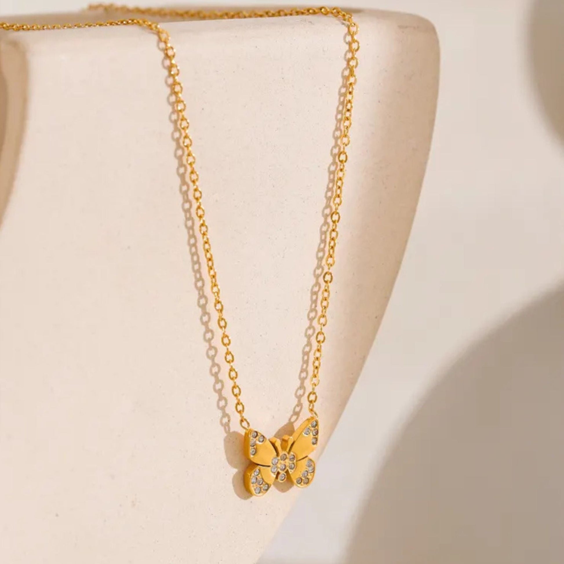Close-Up of Gold-Plated Butterfly Necklace with Stone Details