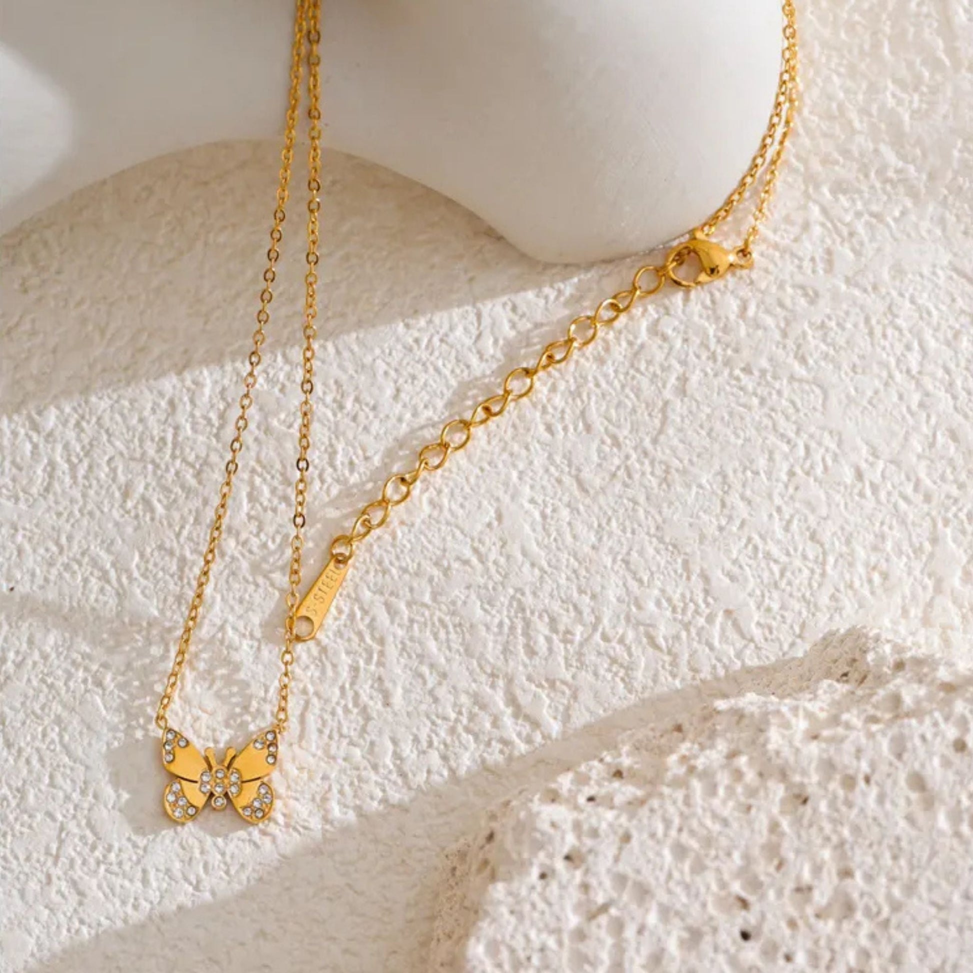 Close-Up of Gold-Plated Butterfly Necklace with Stone Details