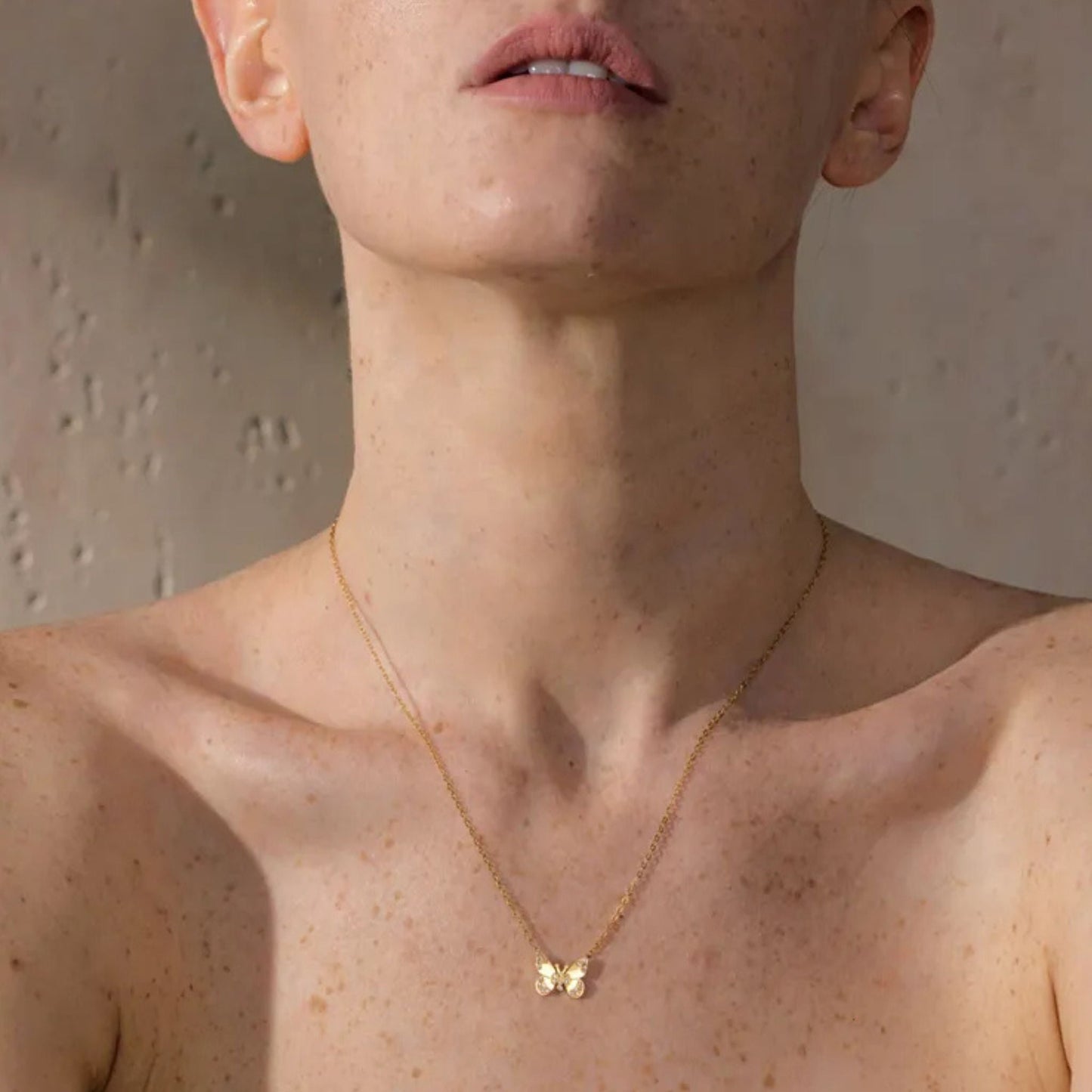 Butterfly Pendant Necklace with Cubic Zirconia Worn by Model